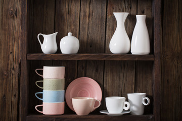  kitchen dishware on old dark wooden background
