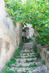 Naklejka premium Small alley with stairs in Sassi of Matera, Italy.