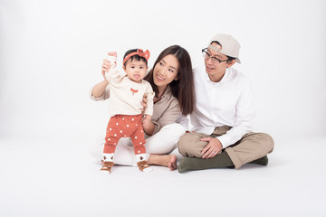 Fototapeta na wymiar Happy Asian family on white background