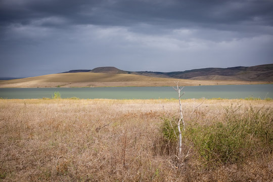 Wonderful view of artificial lake Serra del Corvo on a stormy day . Basilicata region, Italy