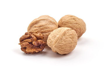 Kernel and whole walnut, isolated on white background
