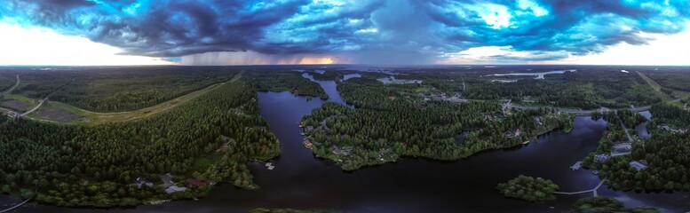 Flying over the forest towards thunderclouds. Karelia