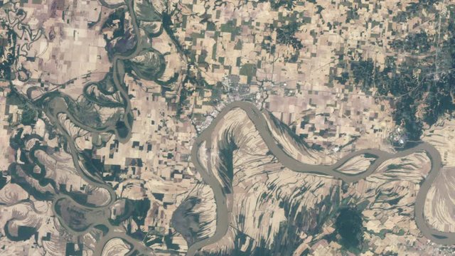 Flooded territory by river time lapse green farmland cultivated landscape animation, aerial satellite view of Ohio river, United States. Images furnished by Nasa