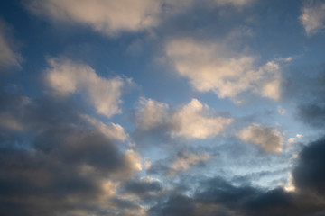 Fototapeta na wymiar Moody evening sky in pink and grey shadows clouds