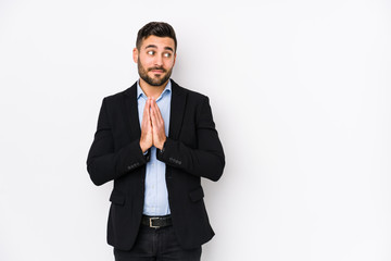Young caucasian business man against a white background isolated making up plan in mind, setting up an idea.