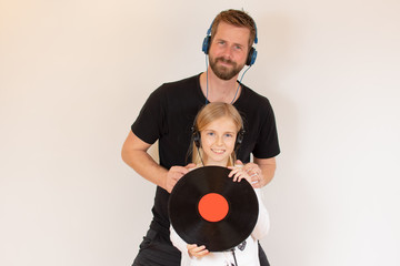 Father and daughter listening to music