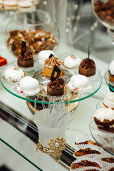 Delicious sweets on candy buffet. Lot of desserts on table. Buffet with a variety of delicious sweets, food ideas, celebration