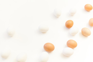 Fototapeta na wymiar white and brown chicken eggs on white background with plenty of space, copy space, laboratory for health and control, biological, hygienic examination cut out