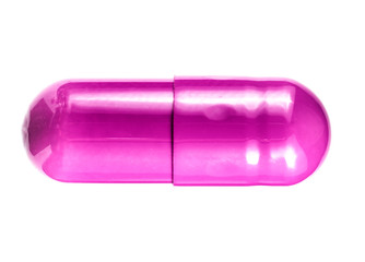 .pink pill on a white background close-up