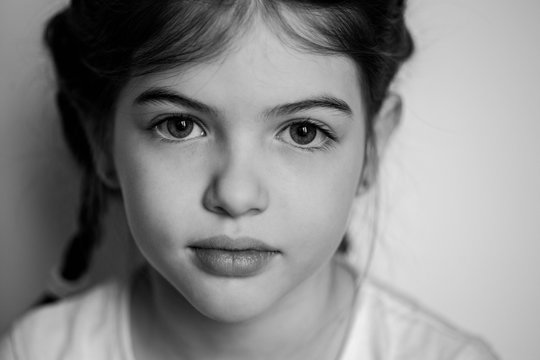 portrait of a young beautiful girl with big eyes, black and white photo