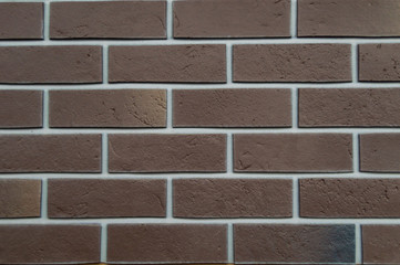 Background brick wall . Brown brick white seams.