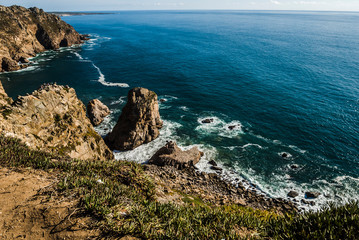 Cabo da Roca is a cape which forms the westernmost point of the Sintra Mountain Range, of mainland Portugal, of continental Europe,