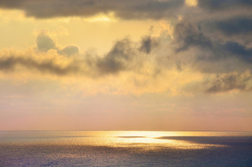 Naklejka na ściany i meble Beautiful Golden Sunset over the Sea .Sea Landscape with Clouds