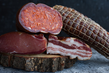 Different types of pork products sausages, ham, bacon