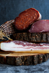 Different types of pork products sausages, ham, bacon