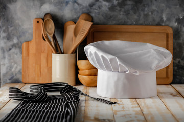 Obraz na płótnie Canvas White cook hat in kitchen and free space for your decoration 