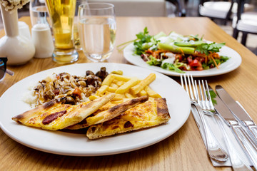 Traditional Turkish Food with Whole Grain Bread ,Salad and French Fries 