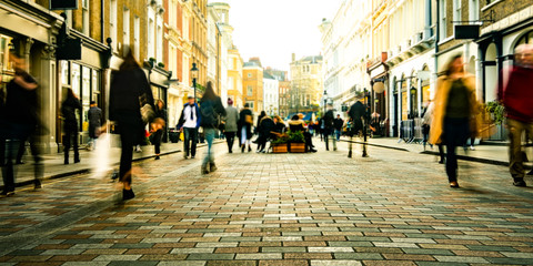 Motion blurred people on shopping street