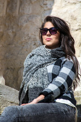 Portrait of Beautiful Young Woman with Black  Sunglasses ,Sweater and Scarf 