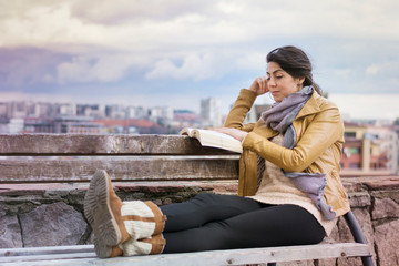 Fototapeta na wymiar Beautiful Woman Reading Book Outdoor 