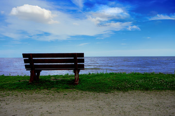 Naklejka na ściany i meble Beautiful Afternoon Scenic Solitary Bench View of the Lake and Sky