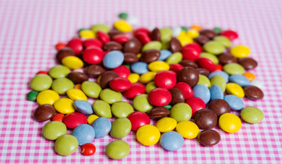 Fototapeta na wymiar Pile of Colorful Chocolate Coated Candy 