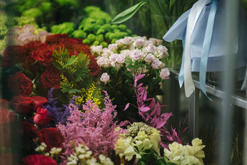 Different varieties fresh spring flowers in refrigerator room for flowers. Beautiful flowers in...