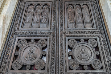 Fragments of the entrance bronze door of the Metropolitan Cathedral of the Annunciation (1862) in Metropolis square in the old town of Athens. Athens, Greece.