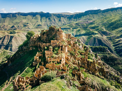 Gamsutl village in Caucasus Mountains. Old stone buildings on top of rock. Summer morning landscape in Dagestan, Russia