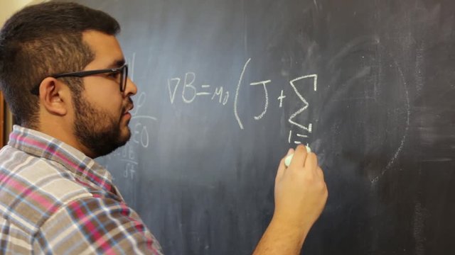 Disagreement between physicist colleagues over chalkboard