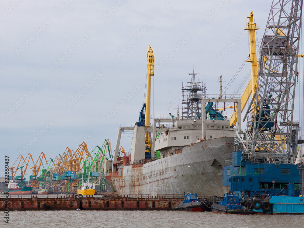 Wall mural container cargo ship and other sea transport in harbor