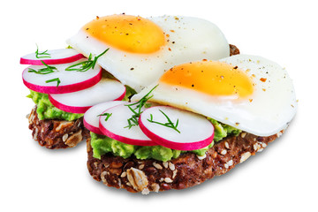 Radish avocado egg rye sandwiches on a white isolated background