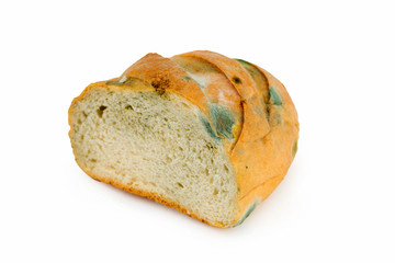 Mouldy bread on a white background. Expired pastries