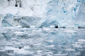Fototapeta na wymiar Broken melting pieces of ice at Antarctic peninsula, stunning icy scenery landscape in Antarctica