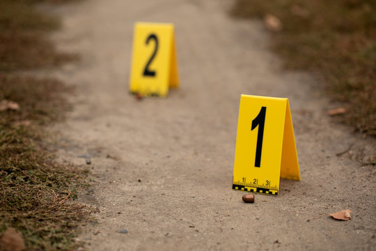 Crime scene with yellow signs.