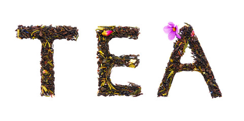 word tea from dry leaves isolated on white background