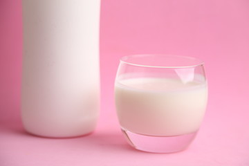 Obraz na płótnie Canvas liquid yogurt bottle in color background
