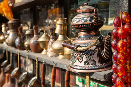 Bronze and copper handcrafted cookware in street shop. Shaki, Azerbaijan.