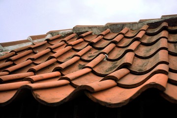 The roof is covered with old tiles. update required. broken tiles in places.