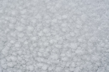 The texture of white snow. White soft background