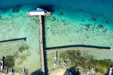 Aerial of fishing dock on island in Indonesia
