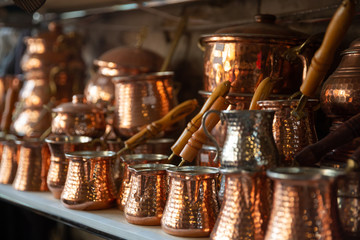 Bronze and copper handcrafted cookware in street shop. Shaki, Azerbaijan.