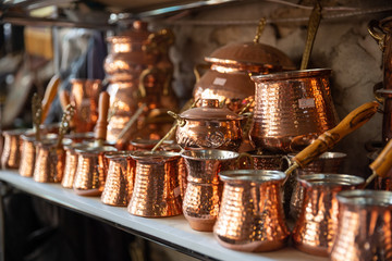 Bronze and copper handcrafted cookware in street shop. Shaki, Azerbaijan.