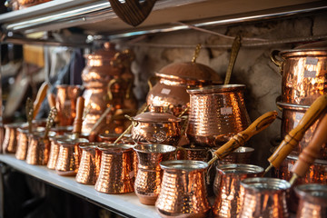 Bronze and copper handcrafted cookware in street shop. Shaki, Azerbaijan.