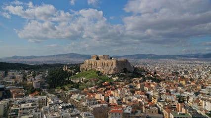 Aerial drone photo of Masterpiece Acropolis hill and the Parthenon and theatre of Dionysus seen below on a beautiful sunny morning, Athens, Attica, Greece