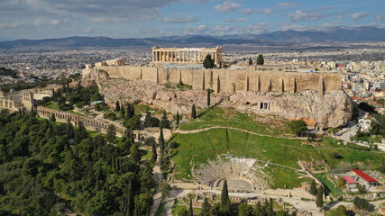Aerial drone photo of Masterpiece Acropolis hill and the Parthenon and theatre of Dionysus seen below on a beautiful sunny morning, Athens, Attica, Greece