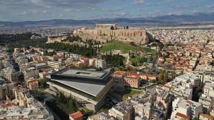 Deurstickers Aerial photo taken by drone of iconic new modern Acropolis museum, Acropolis hill and the Parthenon at the background, Athens historic centre, Attica, Greece © aerial-drone