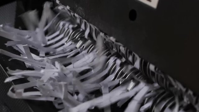 closeup view of office paper shredder teeth 