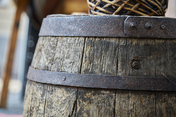 Old wooden barrel on a brown background
