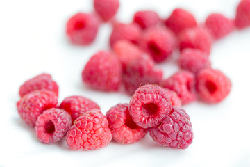 Plate of fresh organic raspberries, healthy diet concept